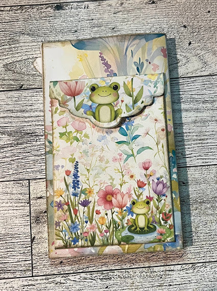 Paper Craft Studios Enchanted Garden Mini Waterfall Folio Cover Page showing back cover with a pocket and a frog and flowers on the flap of the pocket.