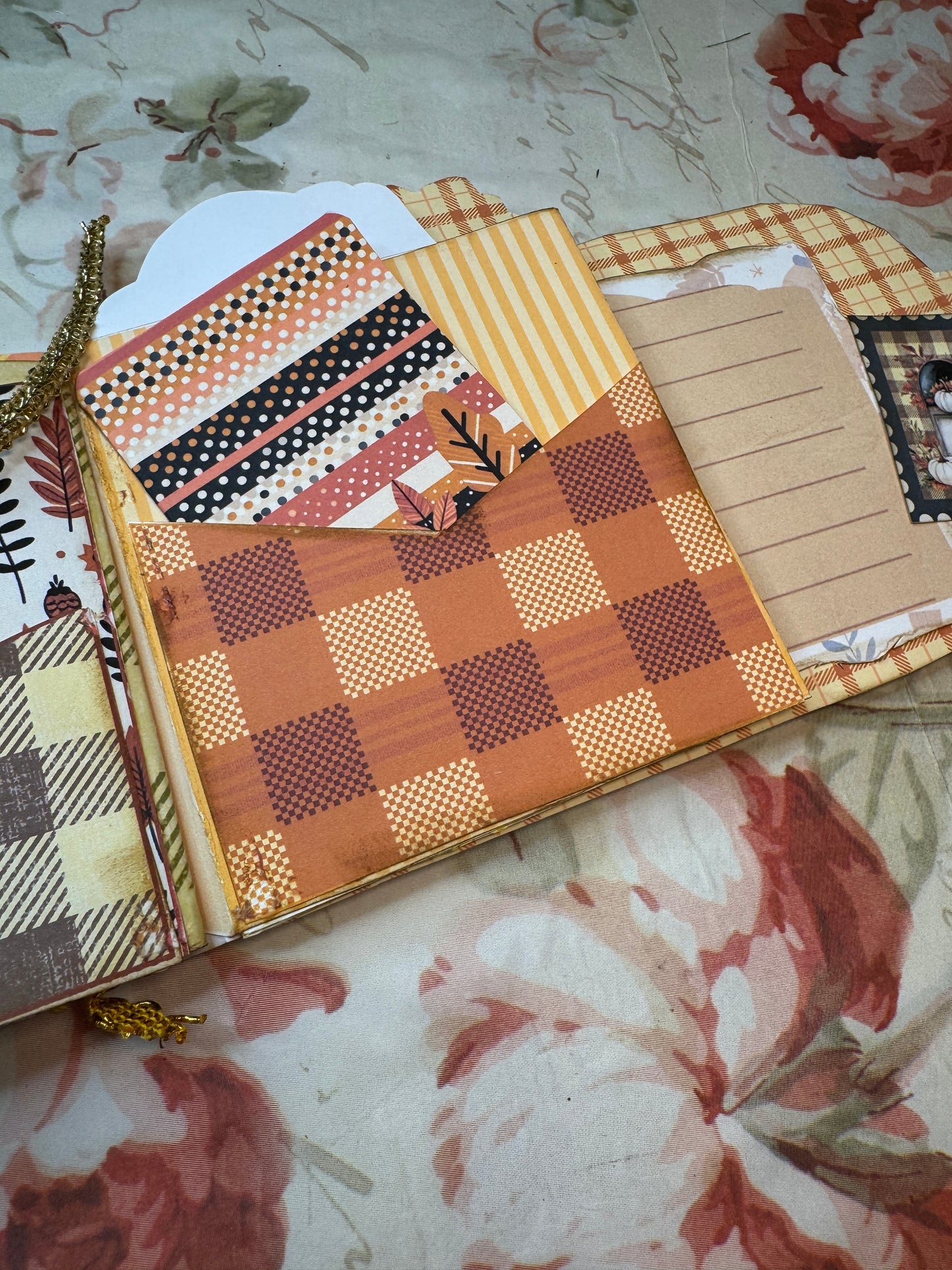 Decorative box with checkered pattern on a floral background