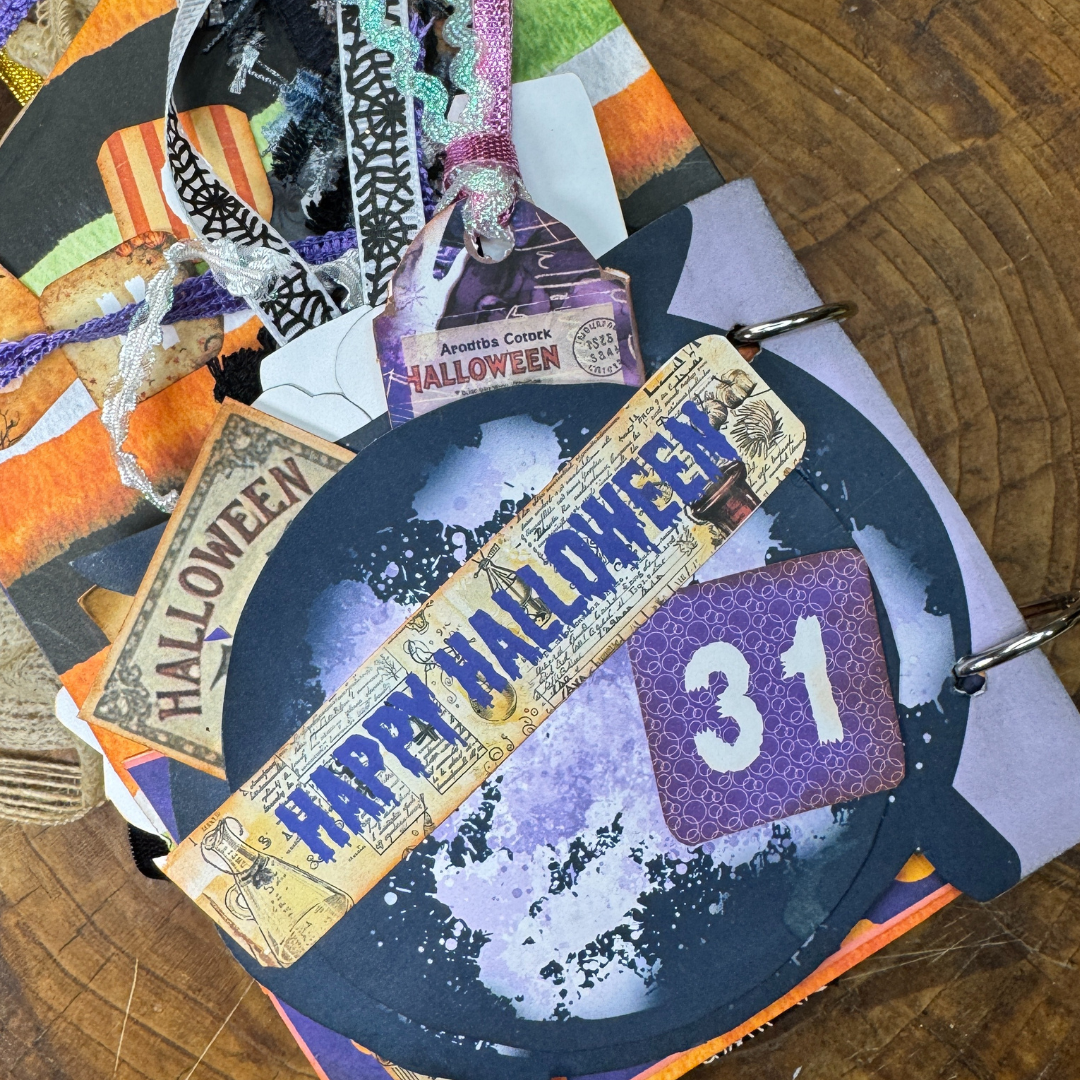 Handmade junk journal with potion bottles and Halloween ephemera