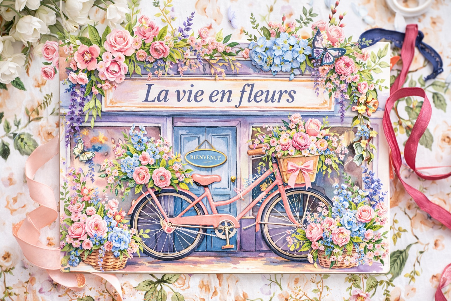 Life’s in Bloom Mini Accordion Journal cover featuring a pink bicycle in front of a floral storefront with bright spring flowers
