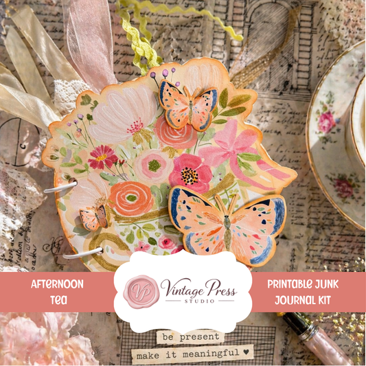Afternoon Tea teacup junk journal with floral paper, butterflies, ribbons, and layered embellishments