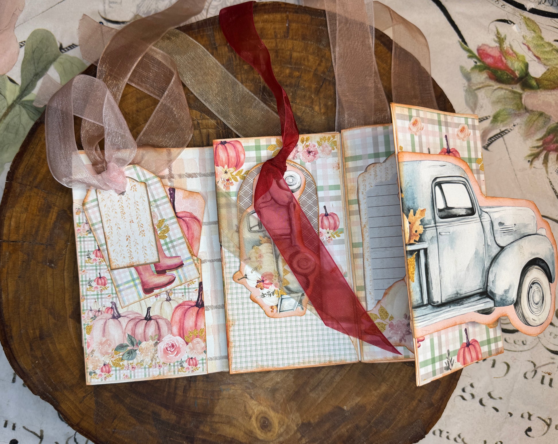 Open fall junk journal folio with vintage truck panel, pumpkin papers, tags, and writing spaces