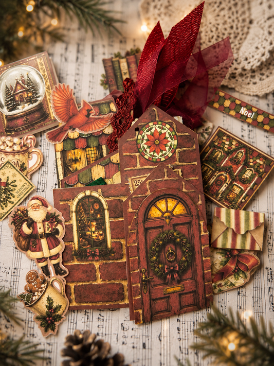 Letters to Santa Junk Journal Folio featuring a brick house-shaped Christmas cover, wreath-trimmed front door, Santa ephemera, snow globe, cardinal, tags, ribbons, and vintage holiday accents.