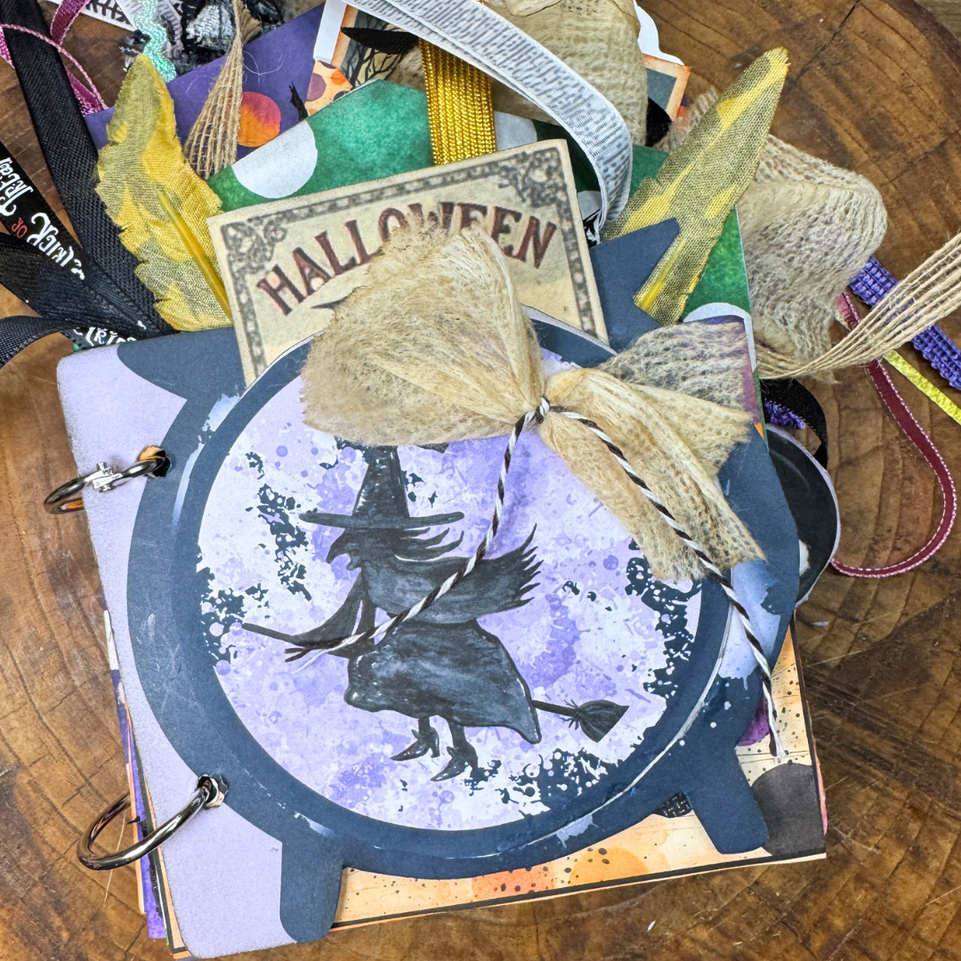 Handmade Halloween junk journal folio with witch and cauldron cover