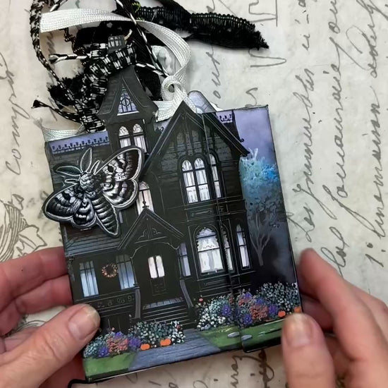 Video tutorial showing how to assemble the Twilight Manor Memory Keeper Halloween junk journal kit with printed folio pages, fussy cuts, and gothic embellishments