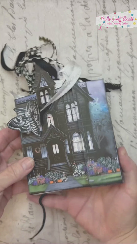 Video tutorial showing how to assemble the Twilight Manor Memory Keeper Halloween junk journal kit with printed folio pages, fussy cuts, and gothic embellishments