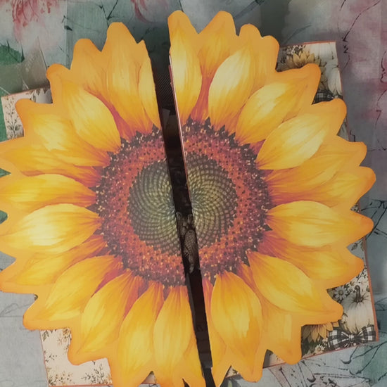 Short flip-through of the Sunflower Harvest Junk Journal Folio showing the dimensional sunflower cover and interactive interior pages with sunflower artwork, buffalo plaid, pockets, tags, journaling spaces, farmhouse ephemera, and harvest-themed fold-outs.