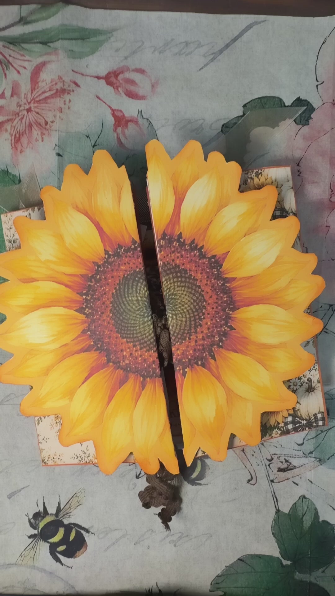Short flip-through of the Sunflower Harvest Junk Journal Folio showing the dimensional sunflower cover and interactive interior pages with sunflower artwork, buffalo plaid, pockets, tags, journaling spaces, farmhouse ephemera, and harvest-themed fold-outs.