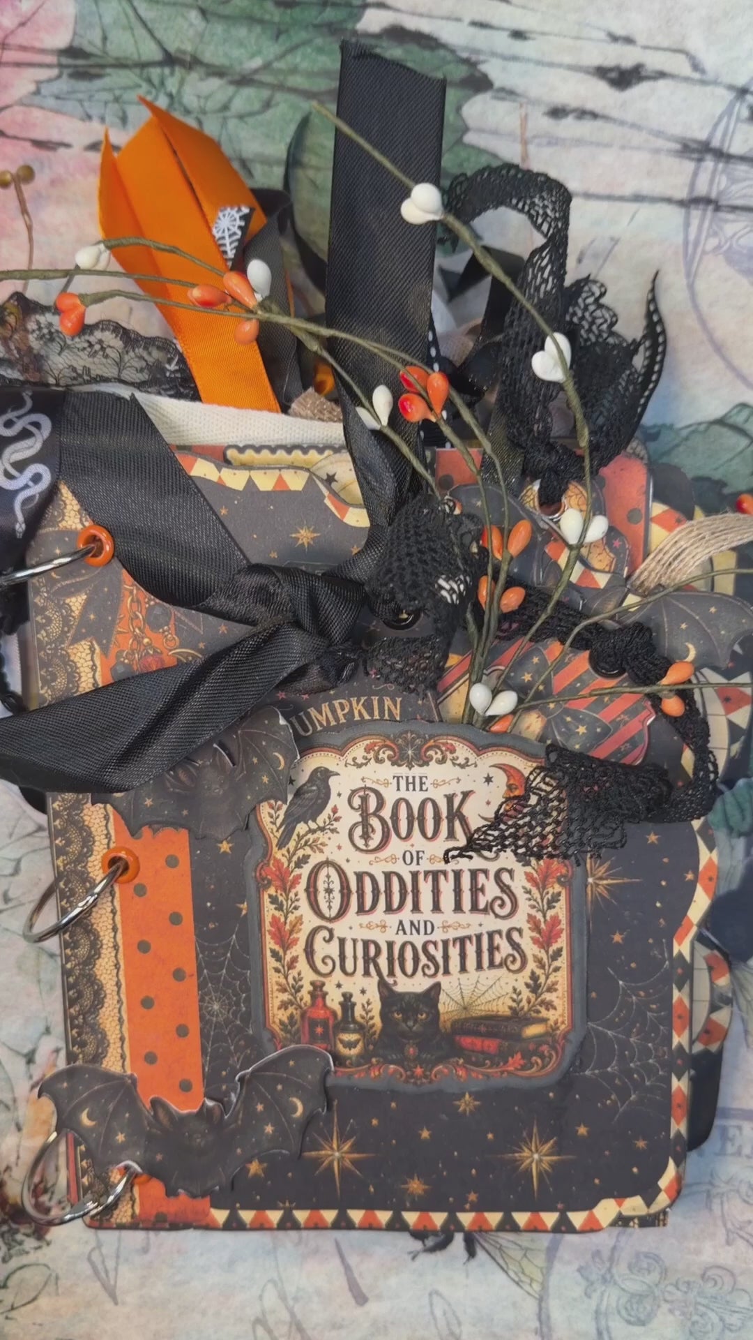 15-second flip-through of the Book of Oddities and Curiosities Junk Journal showing layered Halloween pages, pockets, tags, ribbons, owls, black cats, pumpkins, bats, and vintage ephemera.