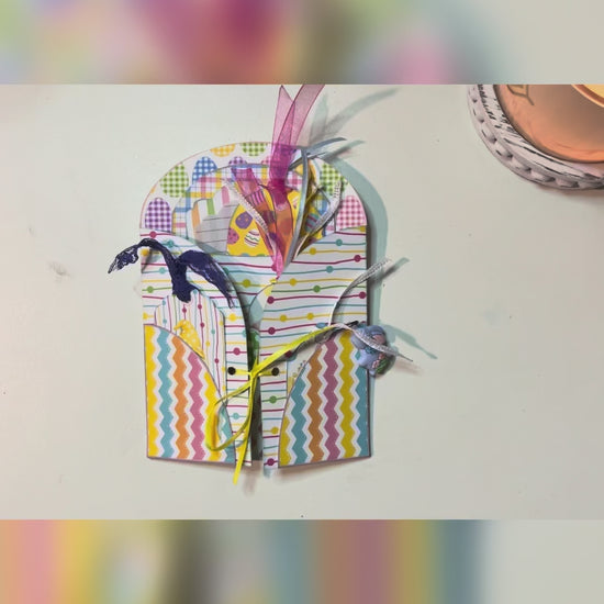 Flip-through video of a pastel Easter junk journal loaded tag kit featuring gnome-themed printable tags, layered ephemera, ribbons, and decorative spring patterns