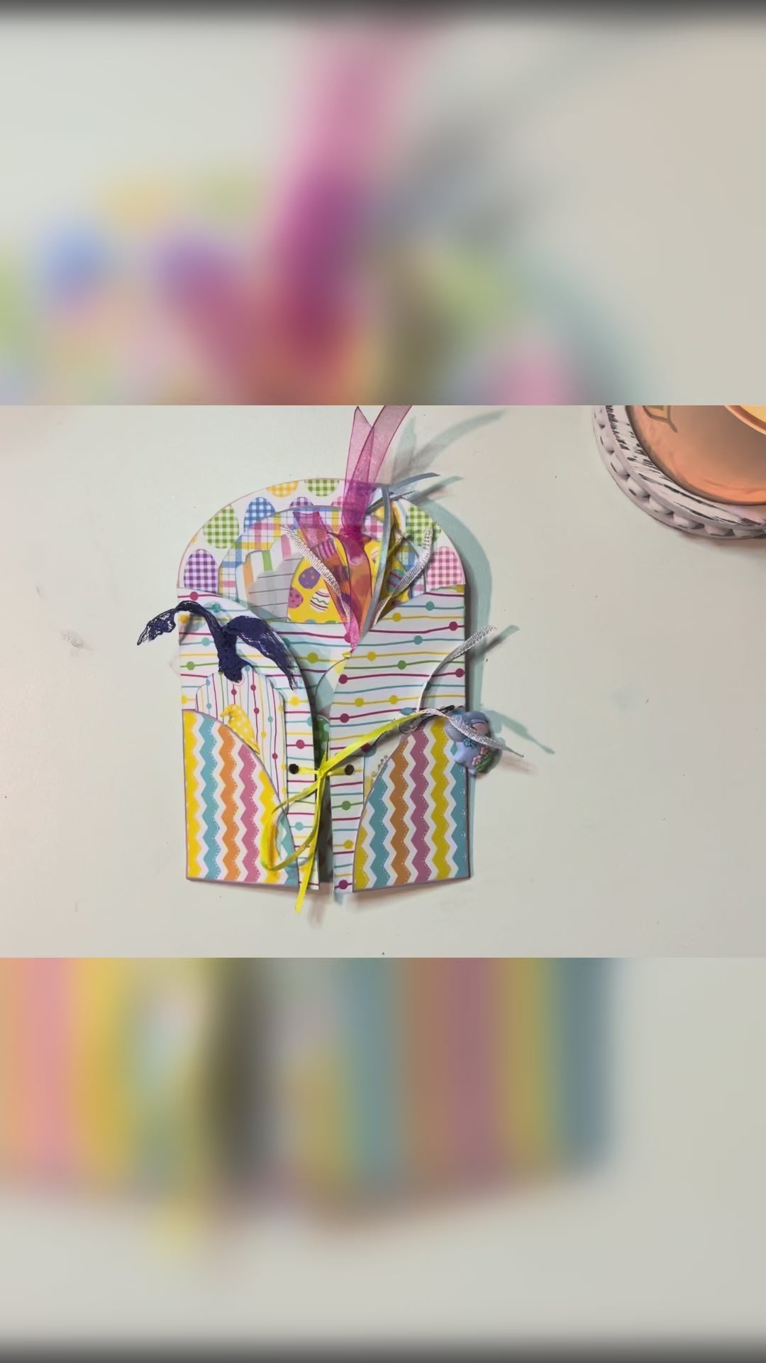 Flip-through video of a pastel Easter junk journal loaded tag kit featuring gnome-themed printable tags, layered ephemera, ribbons, and decorative spring patterns
